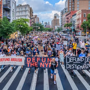 A photograph of protestors on the evening before the NYC budget decision to support defunding the police force.