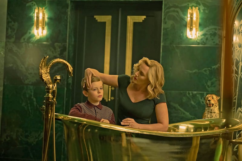 Kate Winslet gives Louie Mynett a bath in a still from 'The Regime'