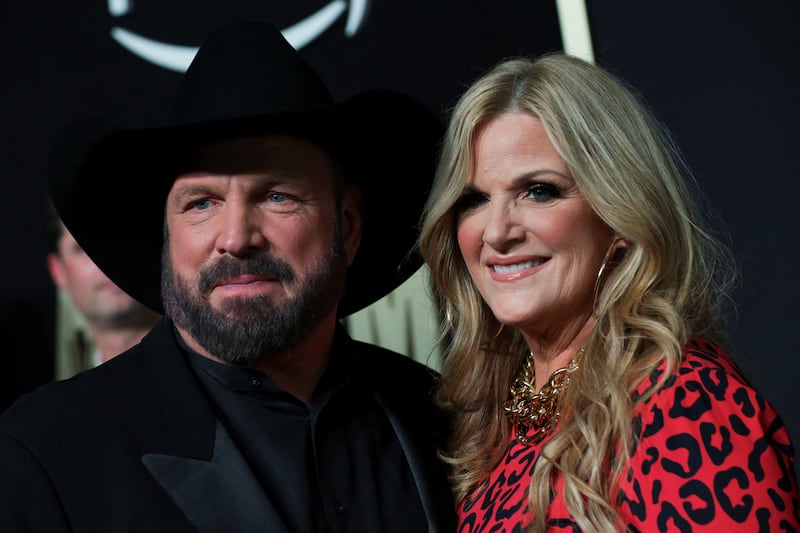 Garth Brooks and Trisha Yearwood smile together.