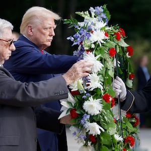 Former U.S. President Donald Trump stands during a wreath laying ceremony at Arlington National Cemetery on Aug. 26, 2024.