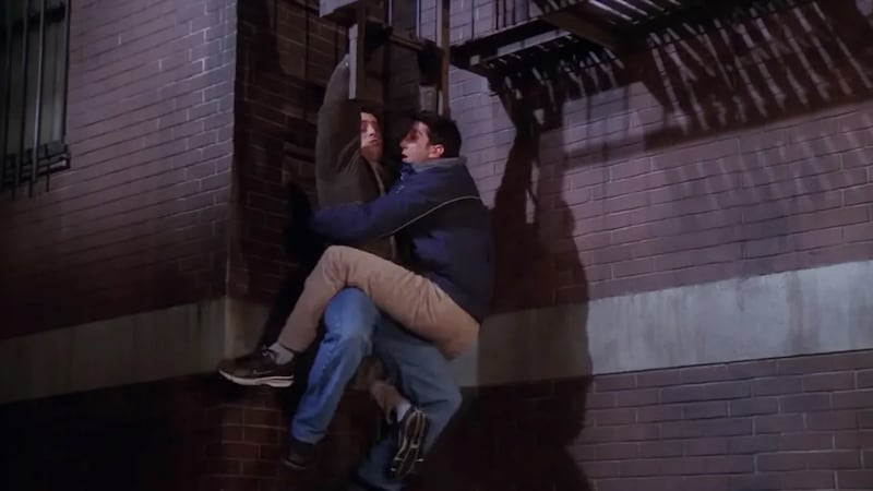 Joey and Ross climb down the fire escape