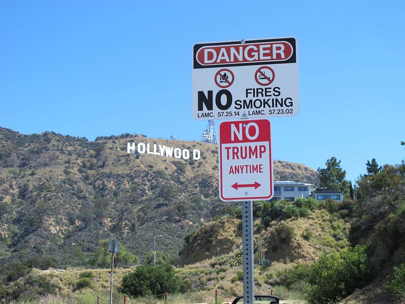 articles/2016/04/25/no-trump-anytime-street-signs-take-over-the-country-courtesy-of-l-a-s-banksy/160425-yamato-plastic-jesus-trump-embed1_ilsz1x