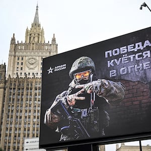 Russian Foreign Ministry building is seen behind a social advertisement billboard showing Z letters - a tactical insignia of Russian troops in Ukraine