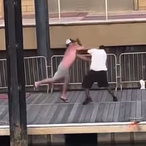 Screenshot of video footage showing the beginning of a big brawl on a dock in Alabama.