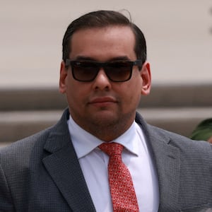 George Santos (R-NY) looks on outside the Central Islip Federal Courthouse on the day of his hearing