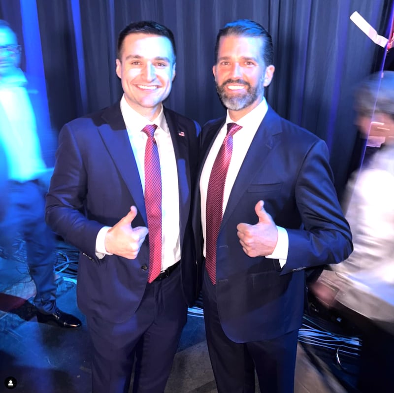 Trump campaign advisor Alex Bruesewitz poses with Donald Trump Jr. backstage at the West Palm Beach Convention Center in West Palm Beach, Fla, on November 6, 2024.