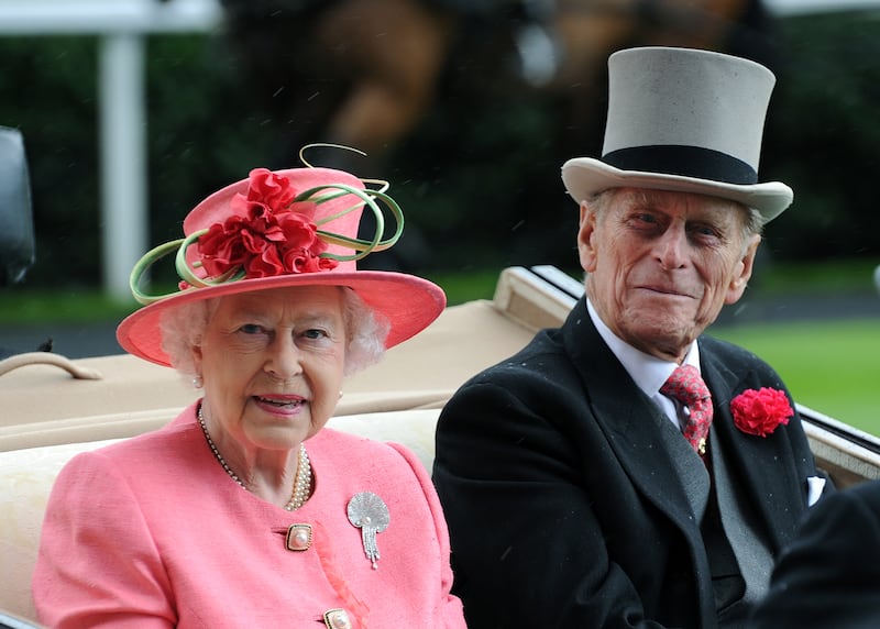 Queen Elizabeth ll and Prince Philip, Duke of Edinburgh arrive in an open carriage on Ladies Day at Royal Ascot on June 16, 2011 in Ascot, United Kingdom.