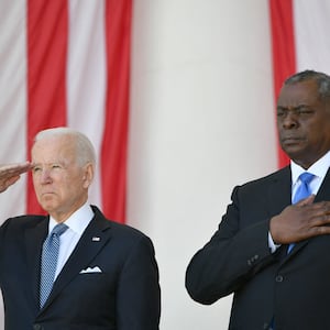 US President Joe Biden(L) salutes along with Secretary of Defense Lloyd Austin before at Arlington National Cemetery on Memorial Day in Arlington, Virginia on May 31, 2021. 