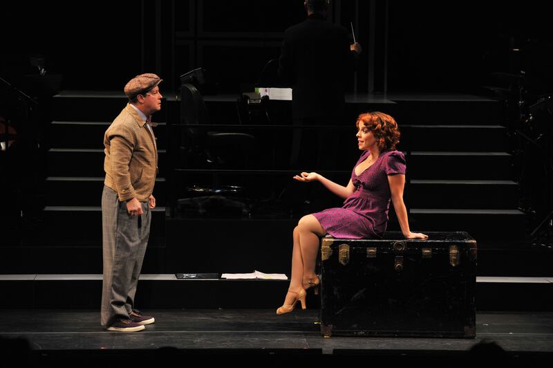 Michael McGrath (Dromio of Ephesus), L, and Leslie Kritzer (Luce) act out a scene during dress rehearsal for Rodgers and Hart's "The Boys of Syracus\" at the Shakespeare Theatre Company's Sidney Harman Hall on November 3,  2011, in Washington, DC.