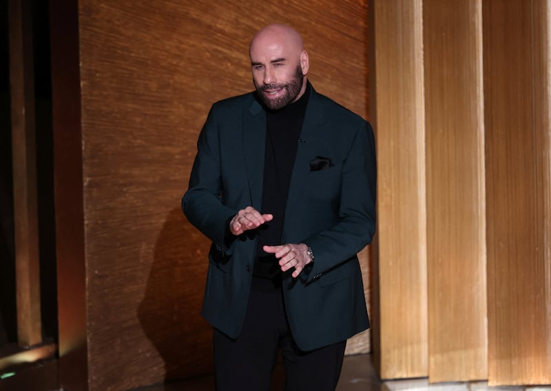 Actor John Travolta speaks at the start of the In Memoriam segment of the Oscars show at the 95th Academy Awards in Hollywood, Los Angeles, California, U.S., March 12, 2023.