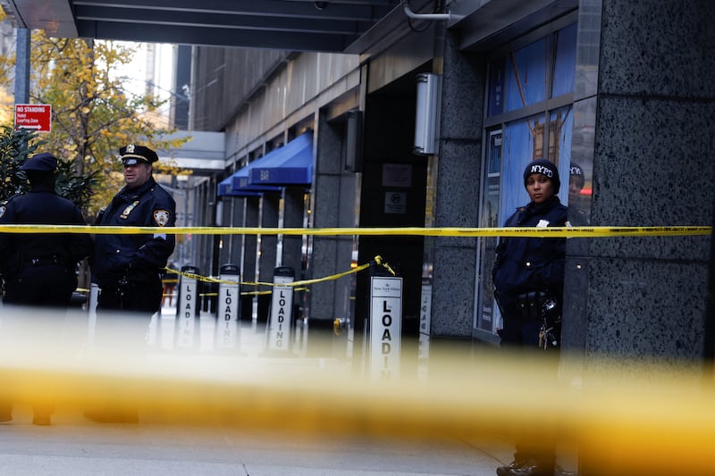 Police officers stand near the scene where the CEO of United Healthcare Brian Thompson was reportedly shot and killed in Midtown Manhattan, in New York City, US, December 4,