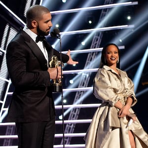 Drake presenting Rihanna with an award at The 2016 VMAs