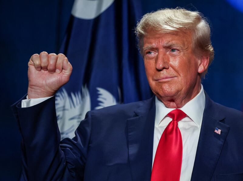 Former U.S. President and Republican candidate Donald Trump gestures at a Republican fundraising dinner in Columbia, South Carolina