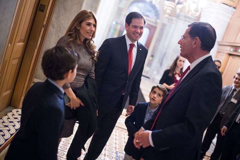 Sen. Marco Rubio, R-Fla., and his wife Jeanette, talk with Sen. John Barrasso