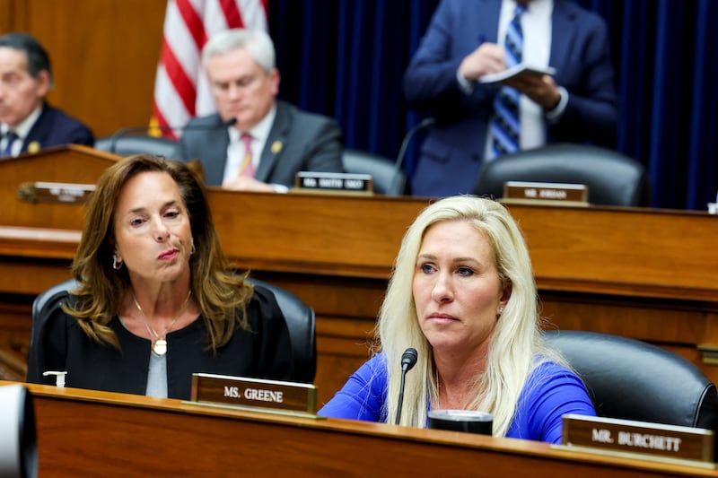 Rep. Lisa McClain (R-MI) and Rep. Marjorie Taylor Greene (R-GA) listen to testimony during a House Oversight and Accountability Committee hearing