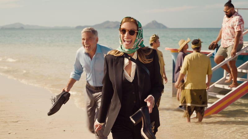 A production still of George Clooney and Julia Roberts in Ticket to Paradise.