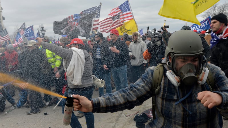 Trump supporters clash with police and security forces as people try to storm the US Capitol Building.