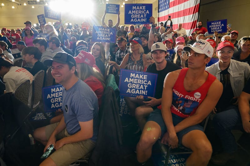 Supporters celebrate the arrival of Donald Trump at a campaign rally in Erie, Pennsylvania. 