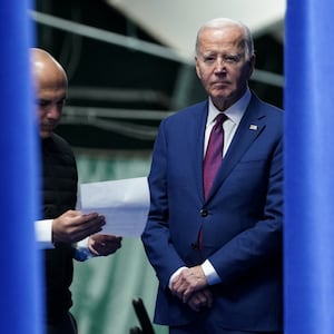 President Joe Biden stands next to aide Ryan Montoya as he prepares to deliver remarks on lowering costs for American families during a visit to Goffstown, New Hampshire.