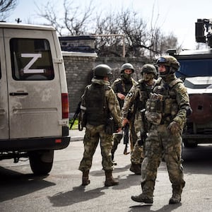 Russian soldiers patrol a street in Volnovakha in the Donetsk region.