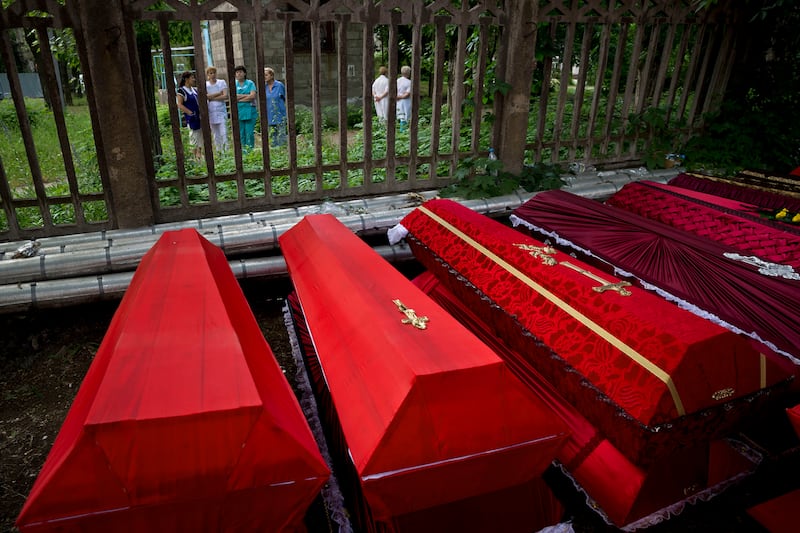 articles/2014/05/29/a-coffin-convoy-to-russia/140529-ukraine-coffins-nemtsova-tease_kzw3ca