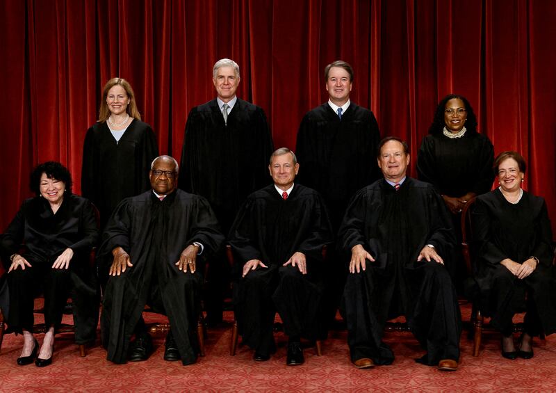 Supreme Court justices: Seated (L-R): Justices Sonia Sotomayor, Clarence Thomas, Chief Justice John G. Roberts, Jr., Samuel A. Alito, Jr. and Elena Kagan. Standing (L-R): Amy Coney Barrett, Neil M. Gorsuch, Brett M. Kavanaugh and Ketanji Brown Jackson.