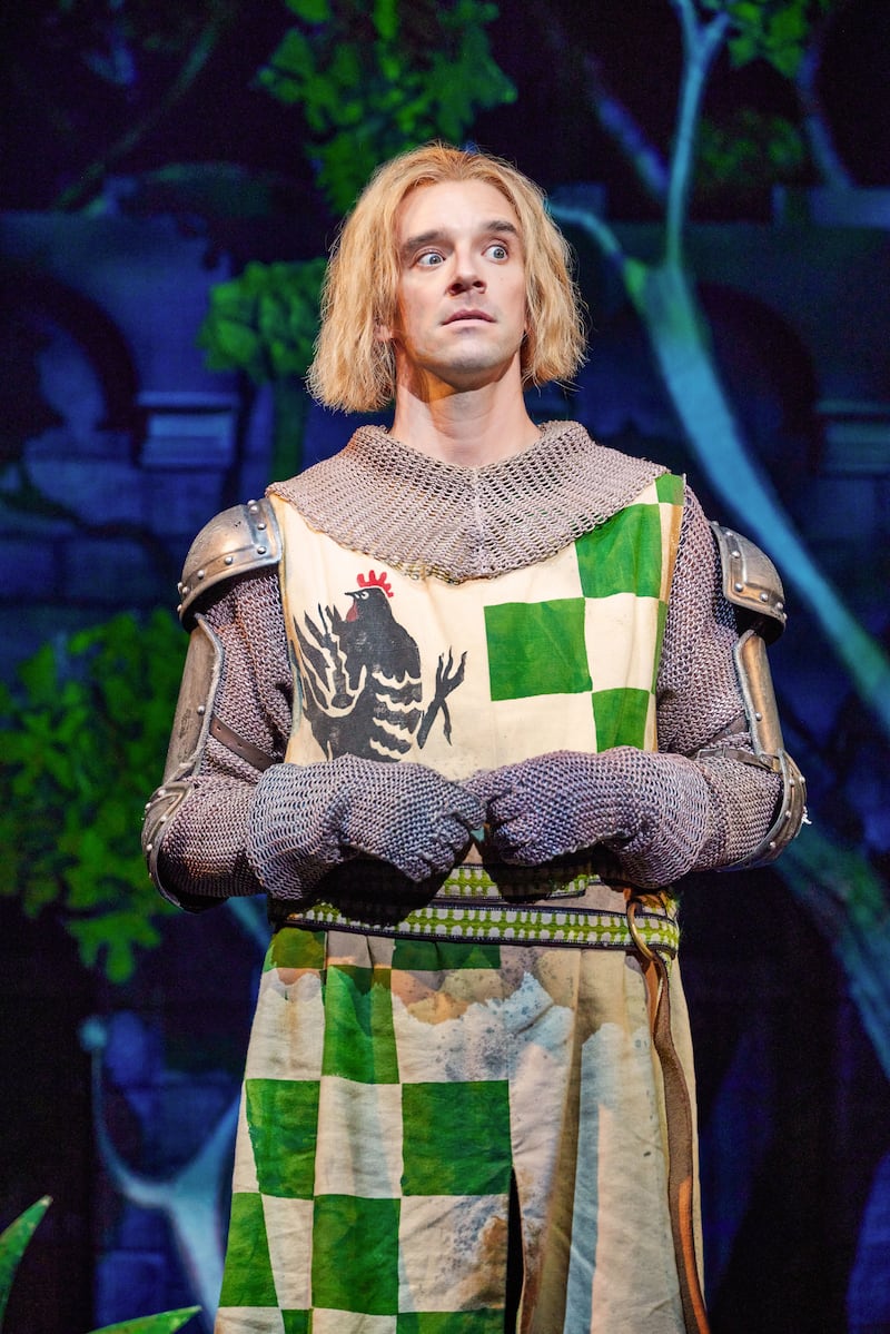 Michael Urie dressed in a green and white coat of armor in a picture from the Broadway musical ‘Spamalot’