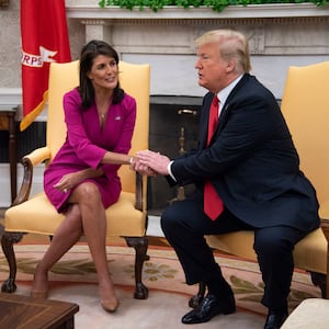 Nikki Haley, United States Ambassador to the United Nations, shakes hands with President Donald Trump.