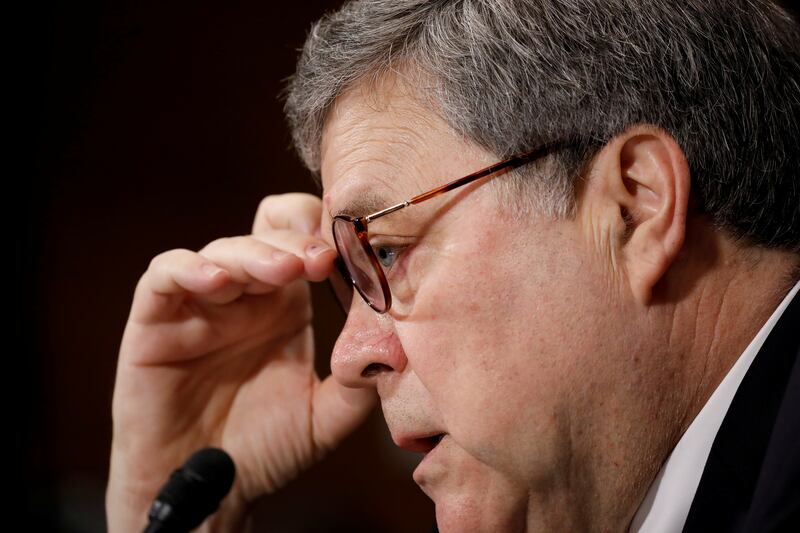 Bill Barr adjusting glasses