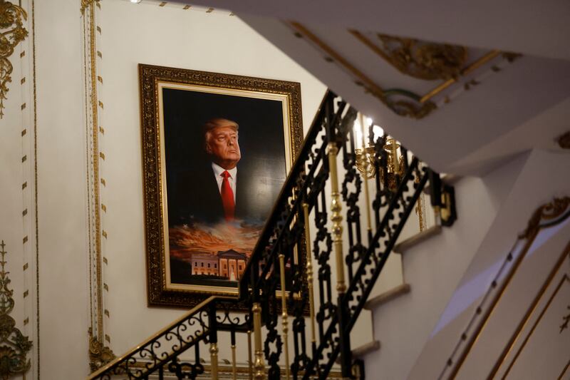 Donald Trump portrait next to a staircase