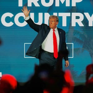 Donald Trump waves to his supporters after giving a campaign speech during the Florida Freedom Summit 