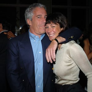 Jeffrey Epstein with his arm around Ghislaine Maxwell.