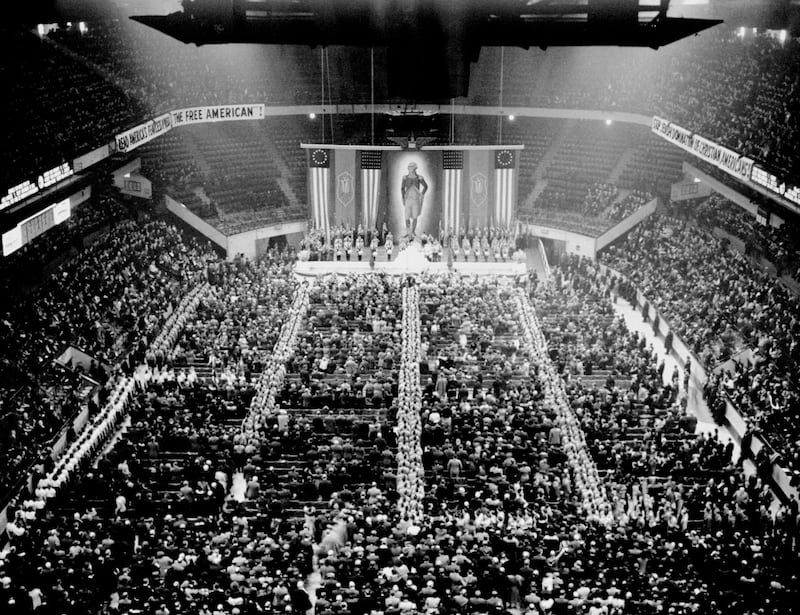 Nazi stormtroopers in double file fill the aisles as the crowd sings "The Star Spangled Banner" at Madison Square Garden.