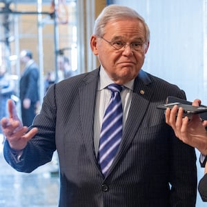 Bob Menendez speaks to a reporter at the U.S. Capitol.