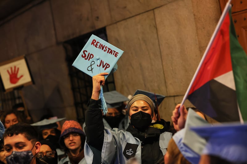 People march as they protest the banning of Students for Justice in Palestine (SJP) and Jewish Voice for Peace (JVP) at Columbia University.