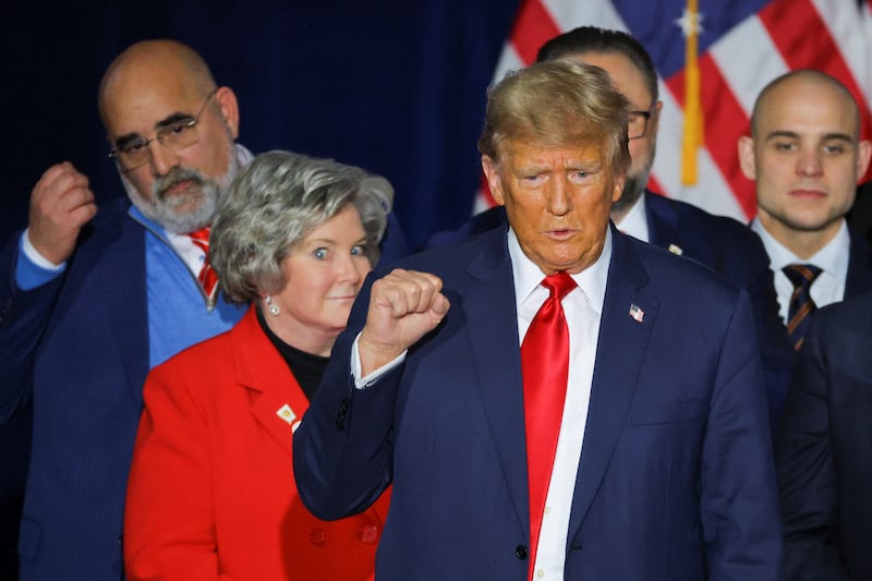 Trump fist-pumping with Chris LaCivita and Susie Wiles behind