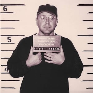 Tim Walz poses for a mugshot