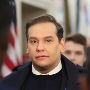 George Santos stares forward as he walks through the U.S. Capitol before a vote to expel him.