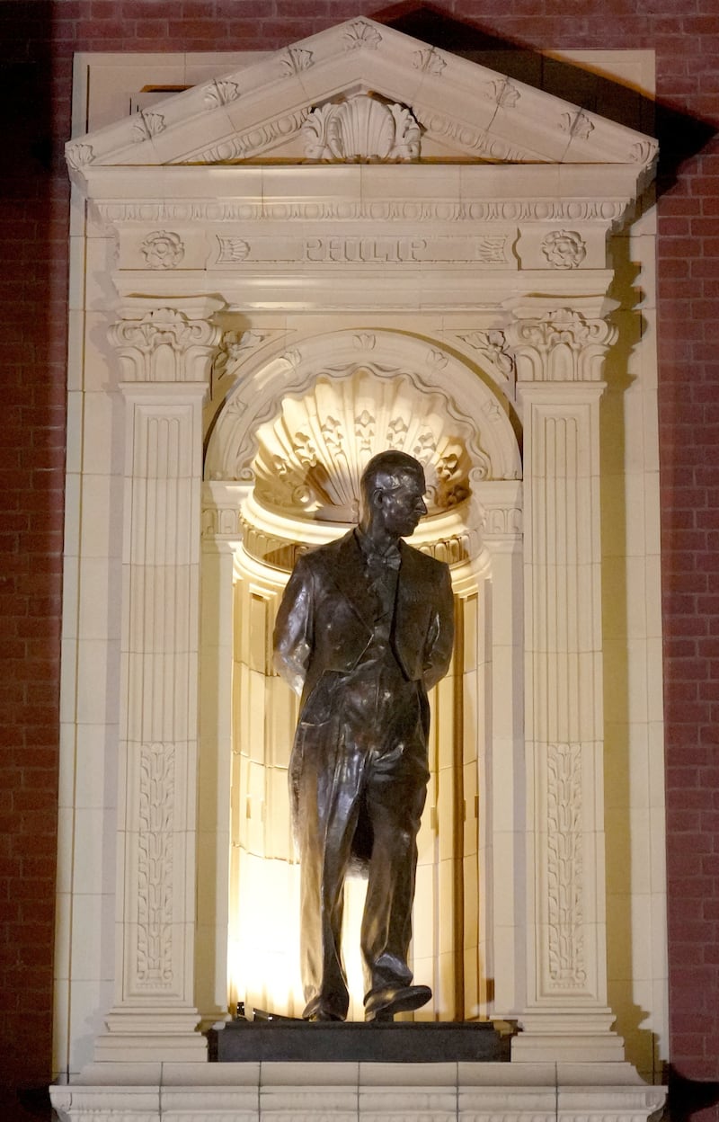 A statue of Britain's Prince Philip is lit up after unveiling by Britain's Queen Camilla upon her arrival to attend the Royal British Legion Festival of Remembrance at the Royal Albert Hall in London, Britain, November 11, 2023.