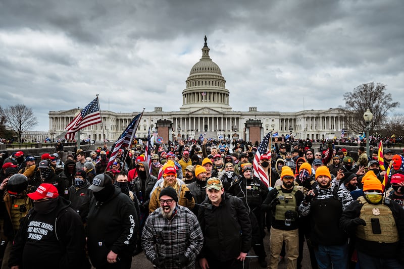 A photo including Pro-Trump protesters 