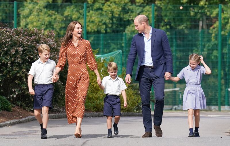 Prince George, Princess Charlotte and Prince Louis, accompanied by their parents Prince William and Catherine.