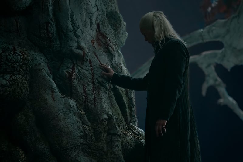 Matt Smith touching the weirwood tree at Harrenhal.