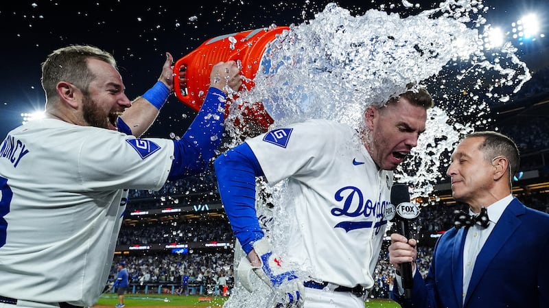 Freddie Freeman is given a Gatorade shower after hitting a walk-off grand slam in the tenth inning of Game 1 of the 2024 World Series.