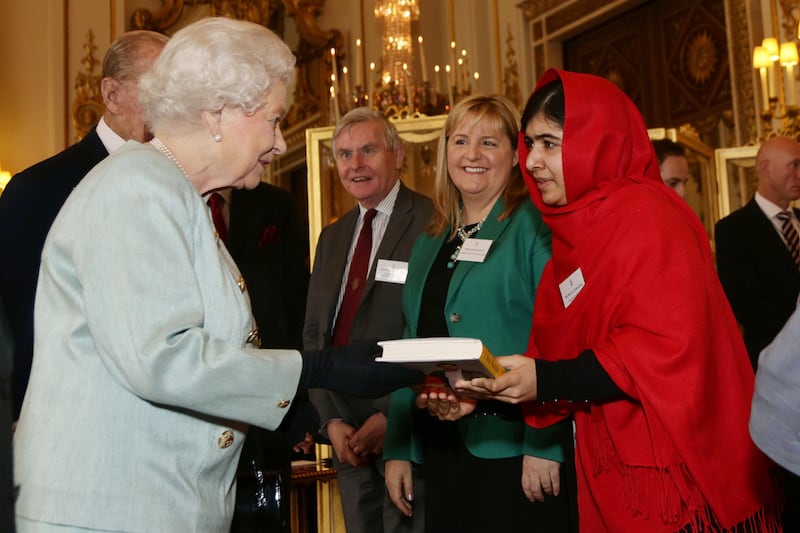 articles/2013/10/18/malala-meets-the-queen/malala-queen_rwgpb1