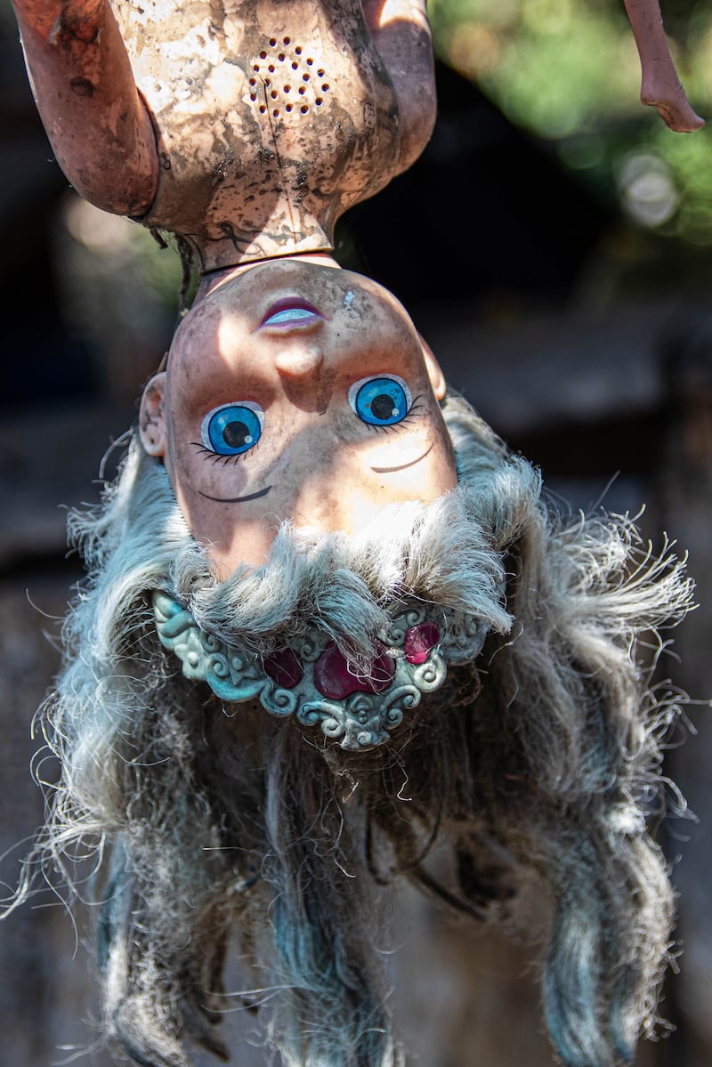 Photograph of a doll hanging on Isla de las Munecas.