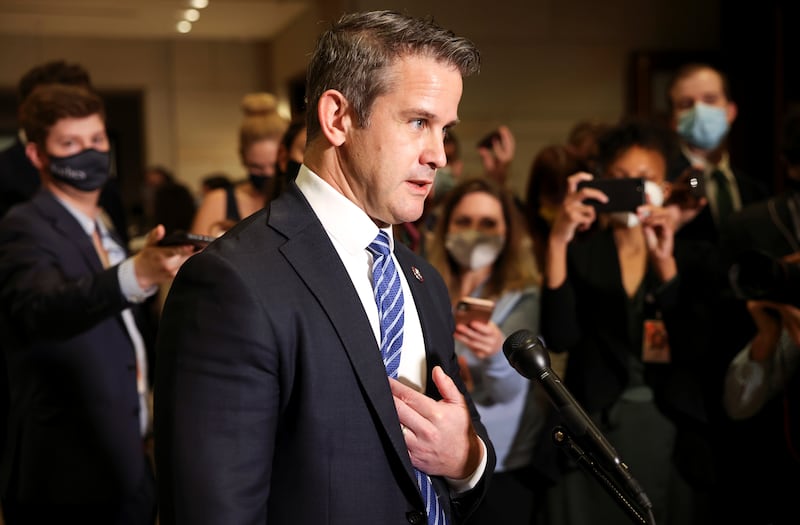 Adam Kinzinger speaks to reporters.