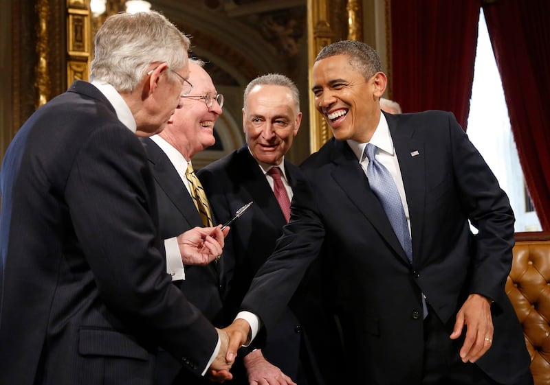 galleries/2013/01/21/president-obama-s-second-inauguration-photos/130121-obama-laughing-post-signature_u61mn4