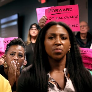 Photograph of Kimberly Thompson listening to Francis Howell School Board members