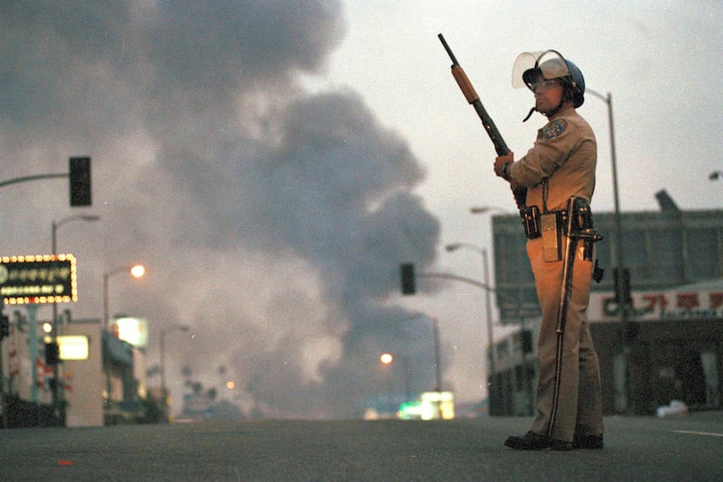 galleries/2012/04/26/dramatic-l-a-riots-photos/los-angeles-riots-officer-smoke_lmdc1c