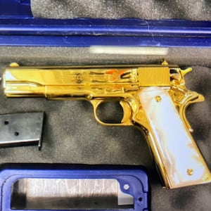 Liliana Goodson’s golden gun.